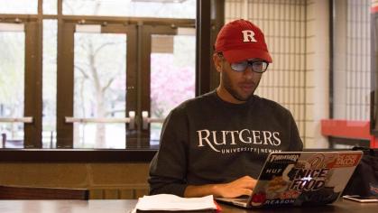 a student studying on their laptop