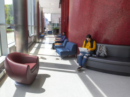 Studying in the first floor lobby of Rutgers Business School - Newark