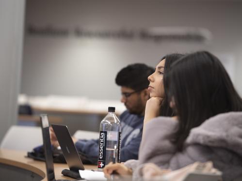 Students listen eagerly to a lecture